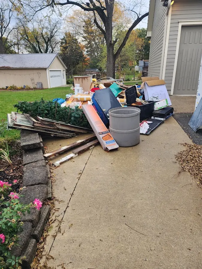 Dumpster being loaded with debris for 3 Yard Dumpster Rental in Jamesburg